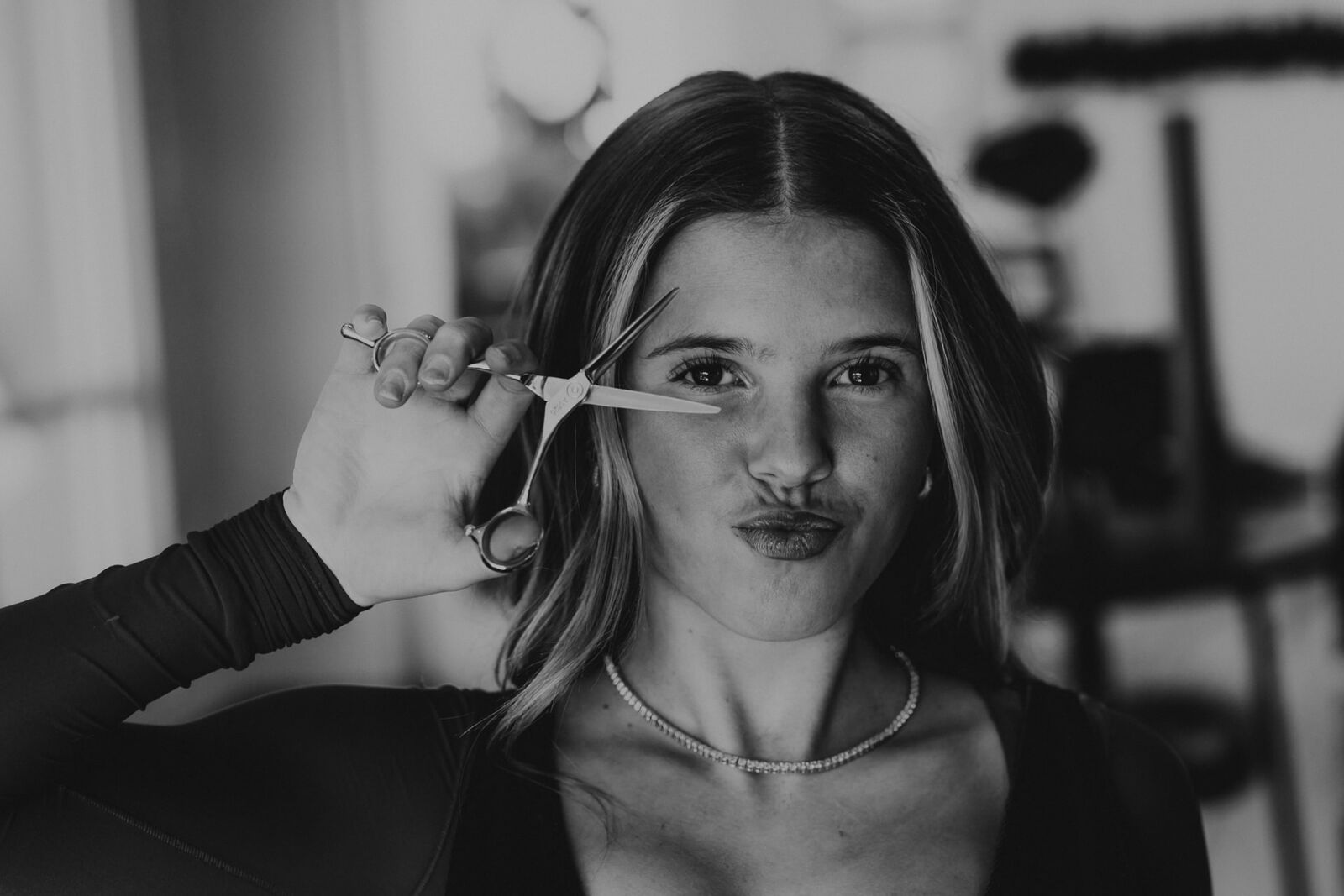 Blaze stylist holding shears